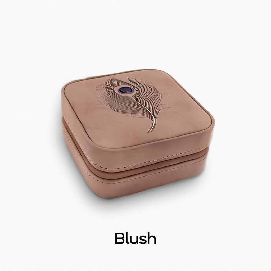 Blush-colored jewelry box with feather design on a white background