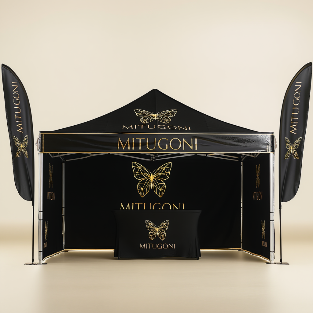 Custom branded black event tent with gold logo, including matching feather flags and table cover for trade shows and exhibitions.