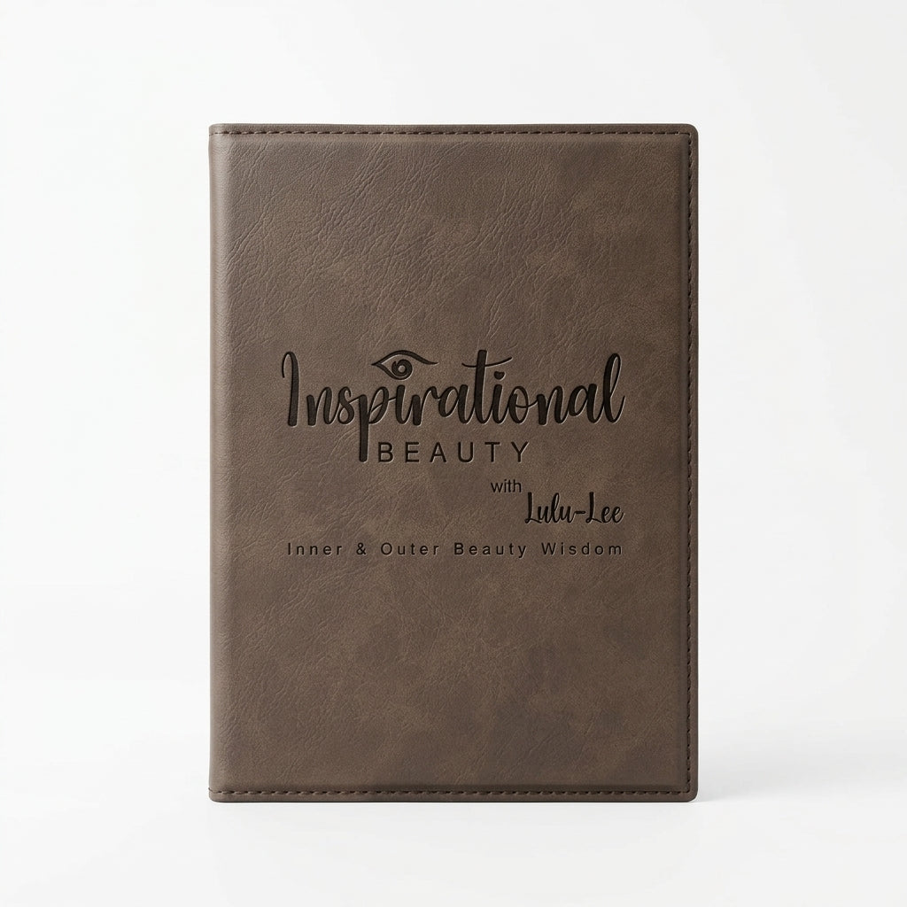 Brown leather notebook with 'Inspirational Beauty' text on a white background