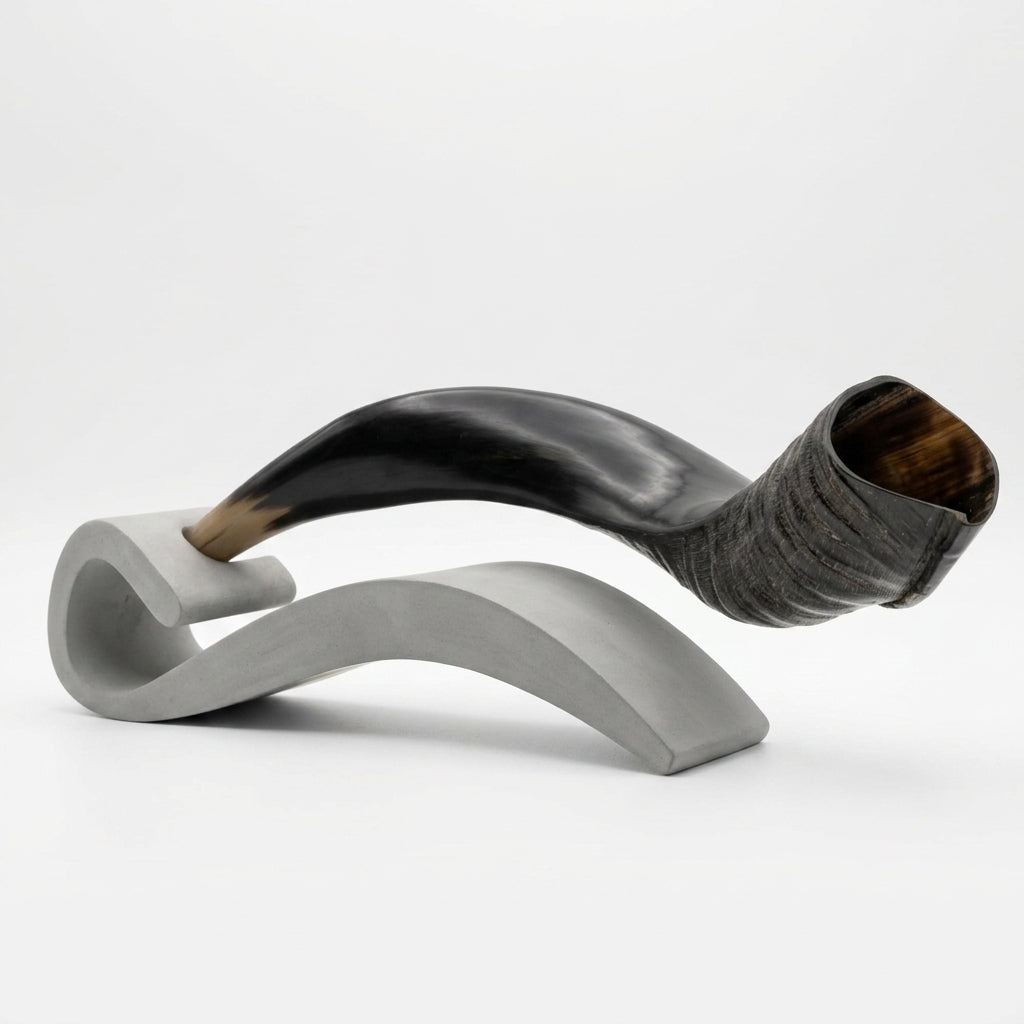 Shofar with white base on a light gray background